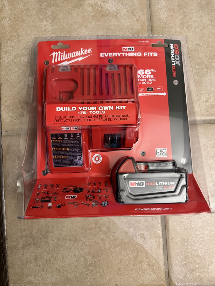 Brand new Milwaukee M18 One 5AH batteries and charger