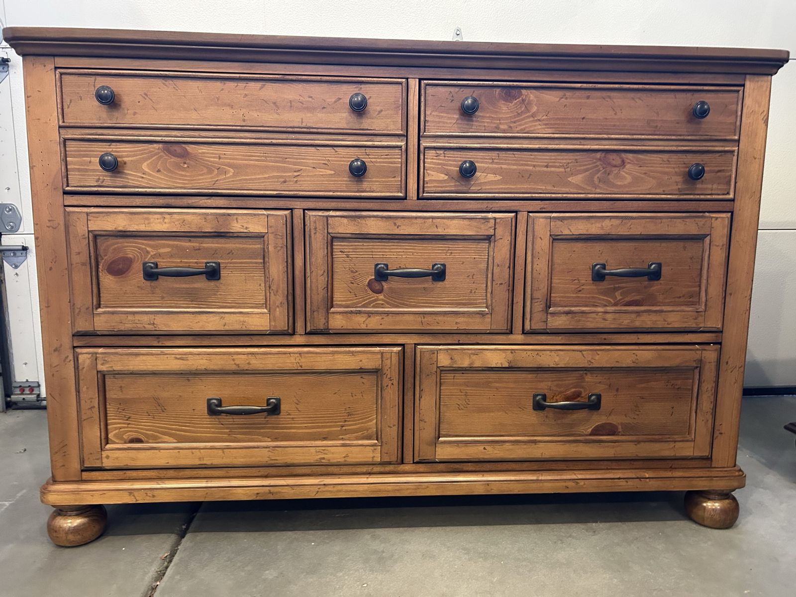 Rustic Light brown 7-Drawer Dresser with Dark Metal Hardware. 