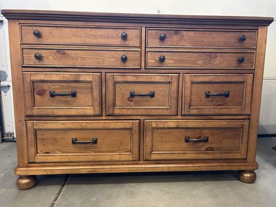 Rustic Light brown 7-Drawer Dresser with Dark Metal Hardware.
