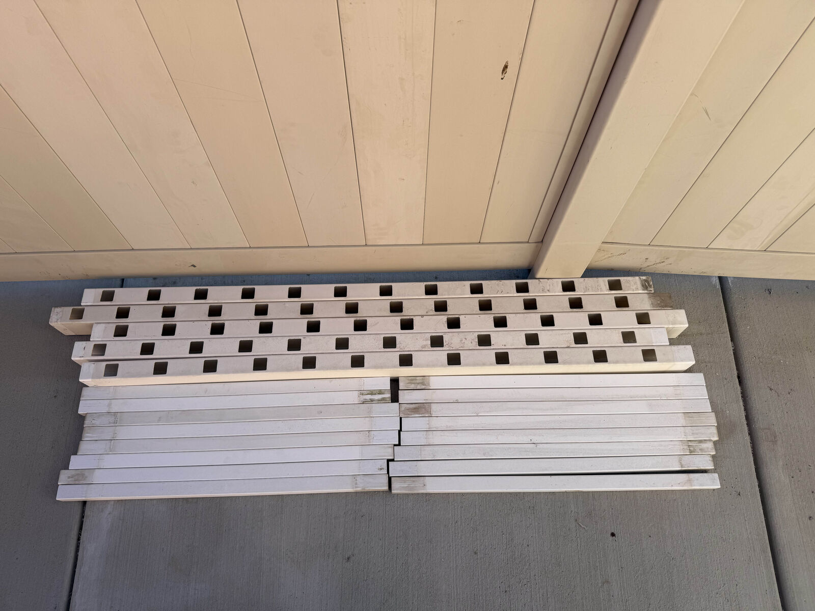 White vinyl Railing pickets and rails.