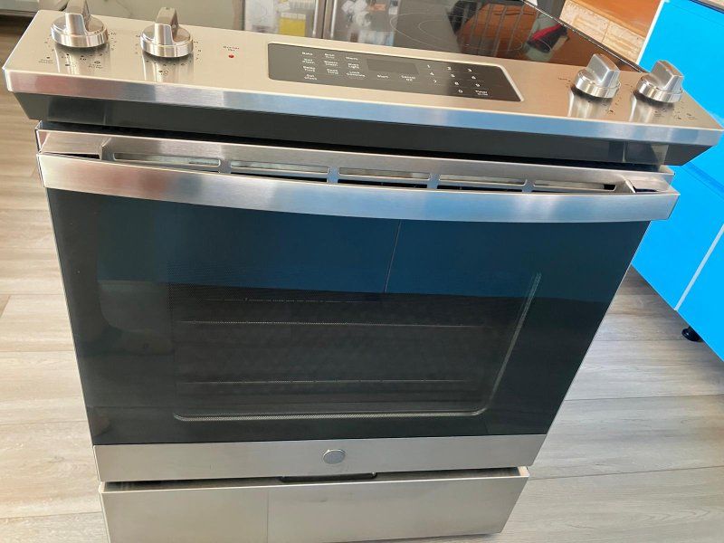 GE Profile 30" Electric Range with Convection Oven and Glass Cooktop in Stainless Steel. 2y old