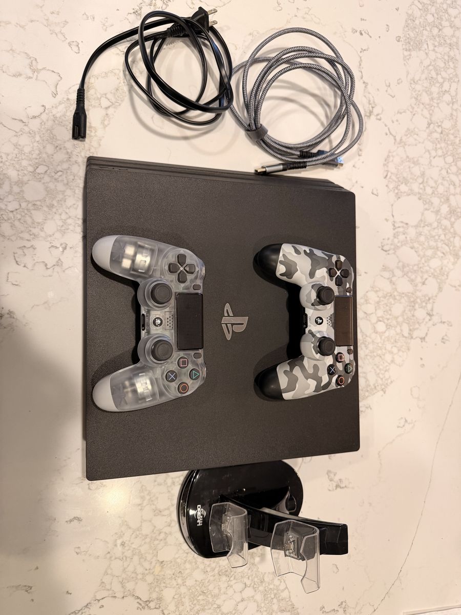 PlayStation 4 Pro Console Bundle with 2 Controllers and Charging Stand (like new)