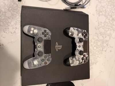 PlayStation 4 Pro Console Bundle with 2 Controllers and Charging Stand (like new)