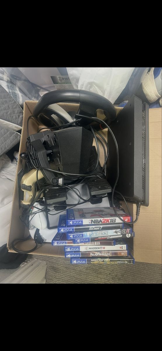 PlayStation 4 Console Bundle with Racing Wheel, Controller, and Games