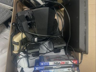 PlayStation 4 Console Bundle with Racing Wheel, Controller, and Games