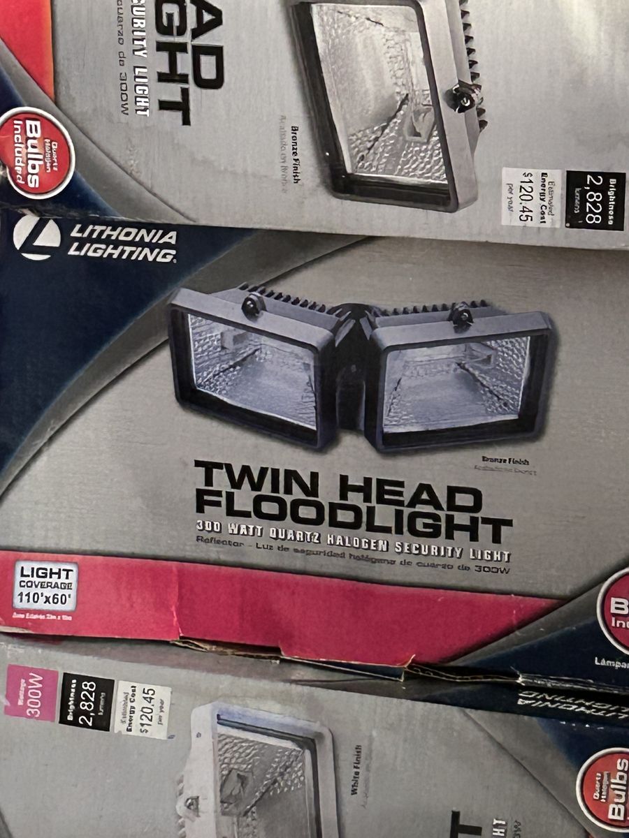 New in box Lithonia Lighting Twin Head Floodlight, 300W Quartz Halogen, Bronze Finish, 2828 Lumens