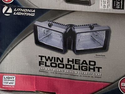 New in box Lithonia Lighting Twin Head Floodlight, 300W Quartz Halogen, Bronze Finish, 2828 Lumens