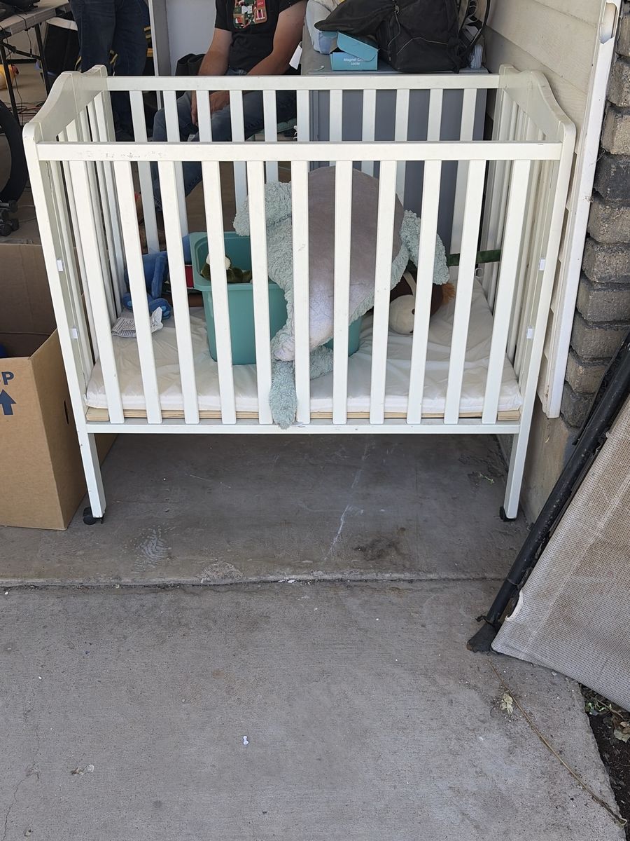 White Portable Mini Crib - Compact Folding Design with Wheels