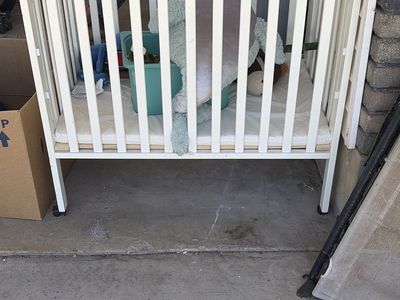 White Portable Mini Crib - Compact Folding Design with Wheels