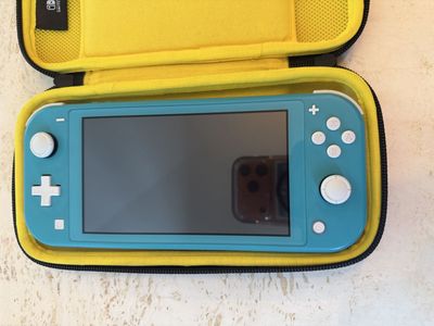 Nintendo Switch Lite Turquoise with 5 Games and Black Carrying Case