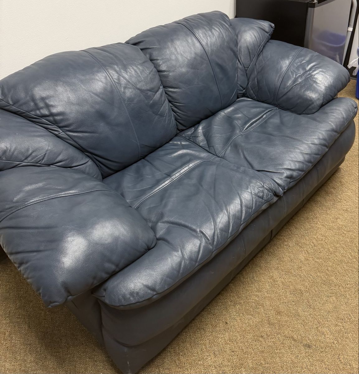 Blue leather loveseat