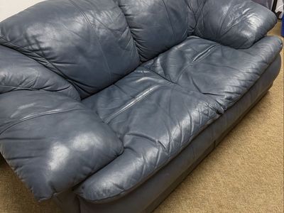 Blue leather loveseat