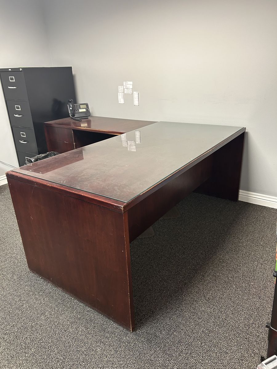 Office desk with glass top and arm return and chair