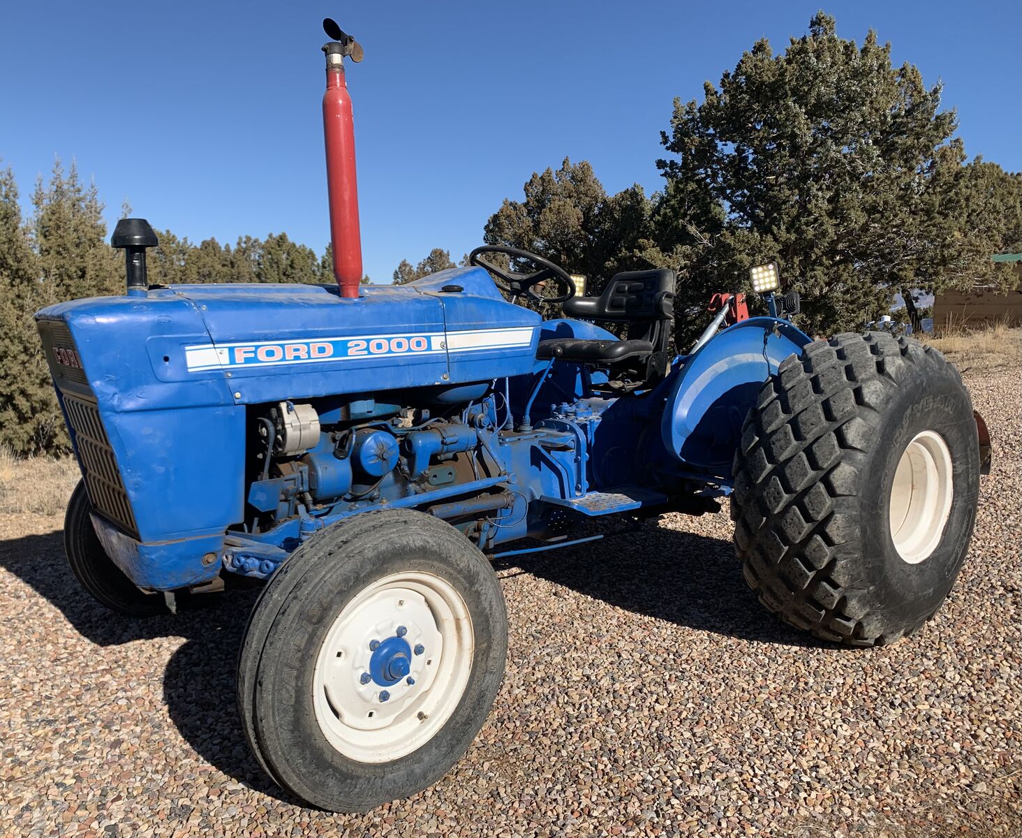 Ford model 2000 diesel tractor with multiple attachments