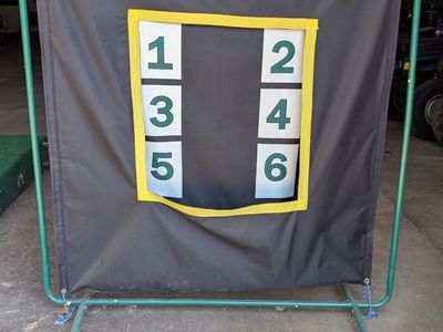 Pitching Backstop with targets and softballs/baseballs included.