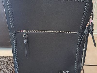 New black suitcase backpack