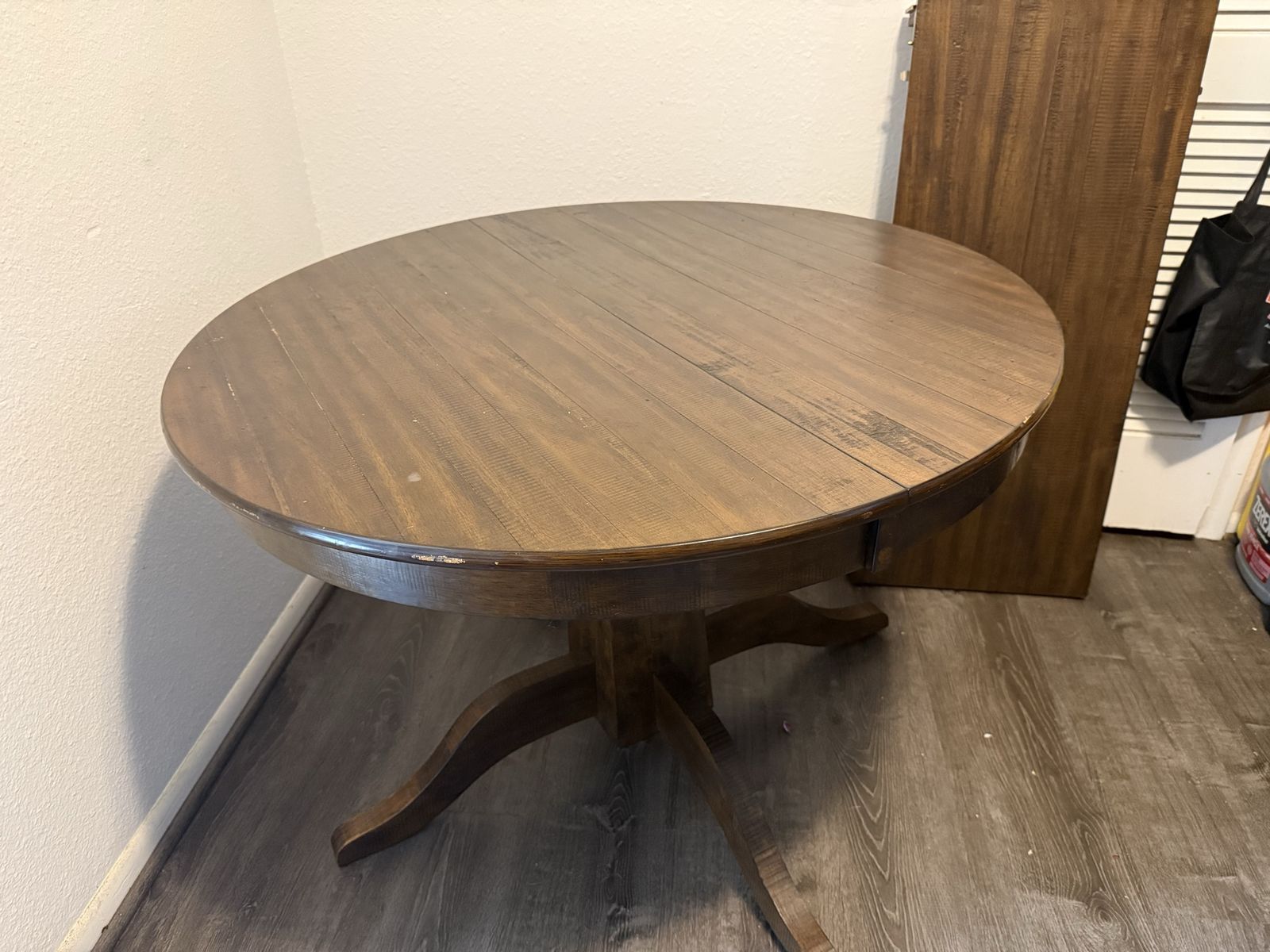 Round Wooden Pedestal Dining Table with Dark Brown Finish