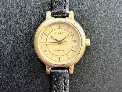 Vintage Tissot Seastar T 101 Swiss Quartz Gold Tone Champagne Dial Date Watch