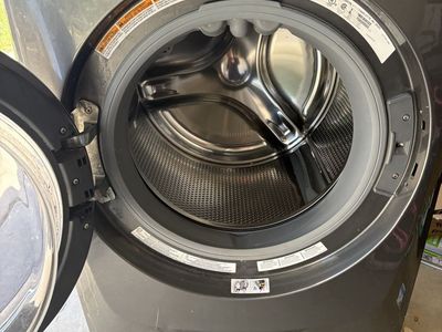 Front load Electrolux Washer and stand.