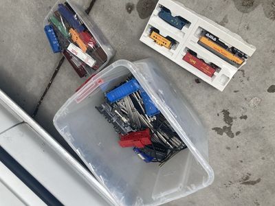Assorted Vintage Lionel & Model Train Cars, Engine, Tracks, and Power Supply Lot