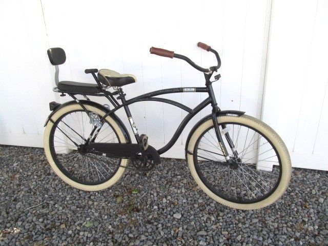 Beach cruiser bicycle with toddler buddy seat