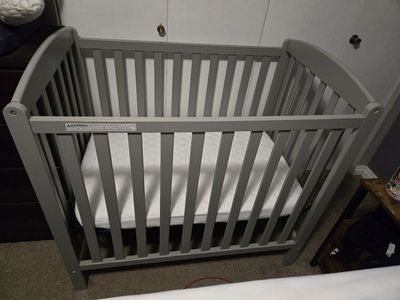 Delta Mini Crib w/ mattress and protector