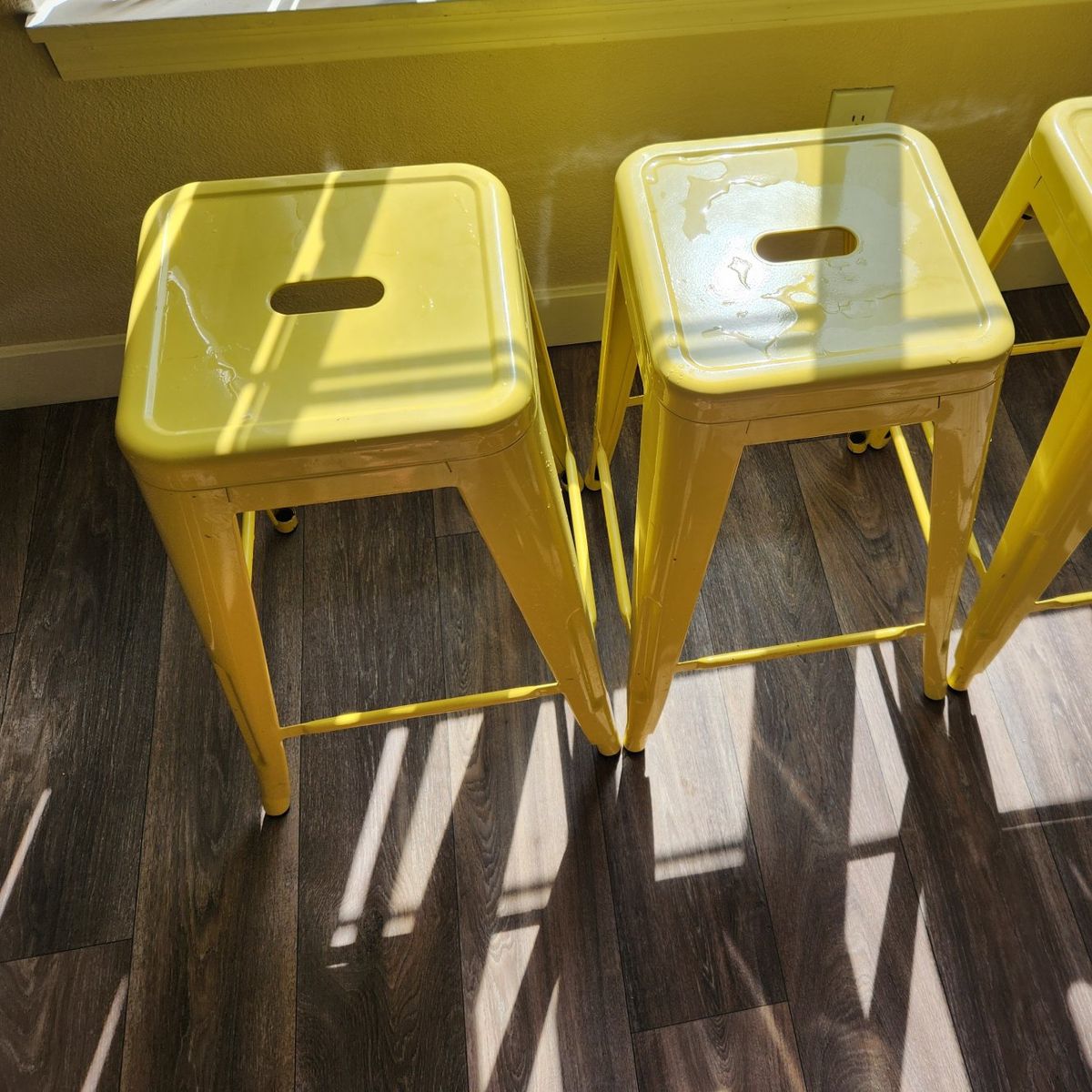 3 yellow stackable bar stools