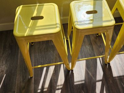 3 yellow stackable bar stools