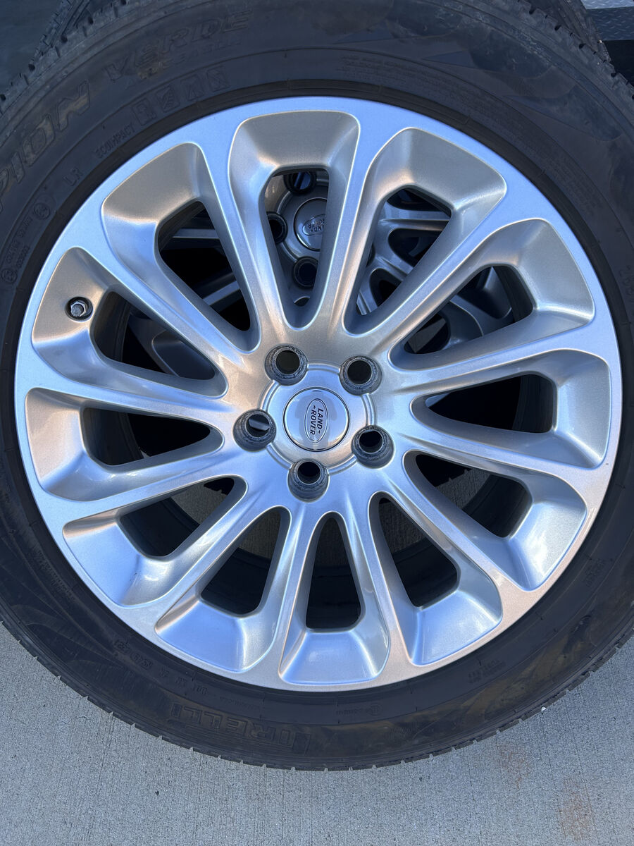 20" Range Rover Factory Wheels and Tires with TPMS sensors and center caps.