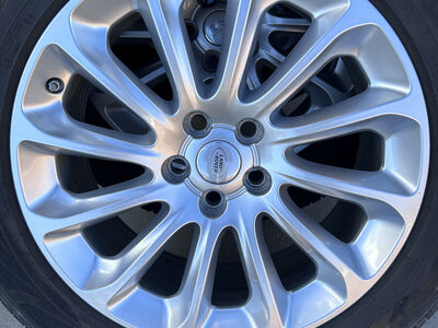 20" Range Rover Factory Wheels and Tires with TPMS sensors and center caps.