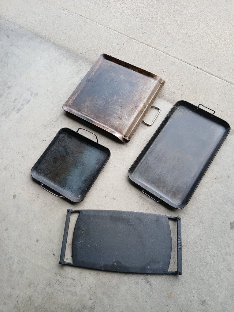 Various cast iron skillets and Dutch ovens