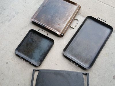 Various cast iron skillets and Dutch ovens