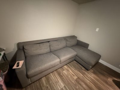 Graphite Couch W/ pullout bed and storage space