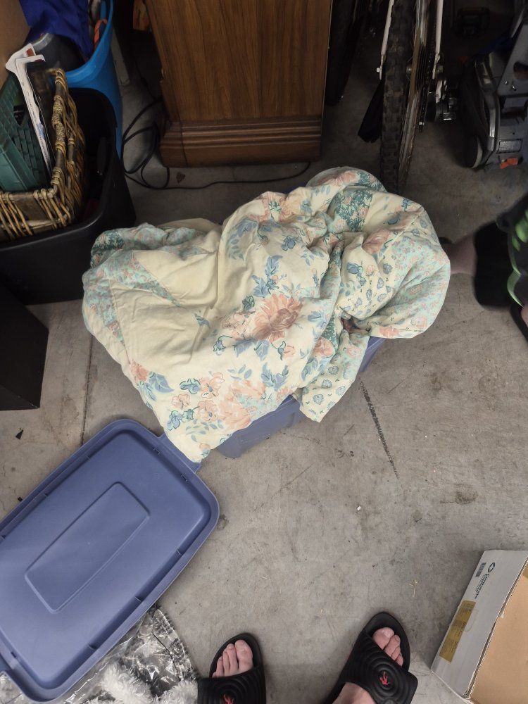 bin of different blankets