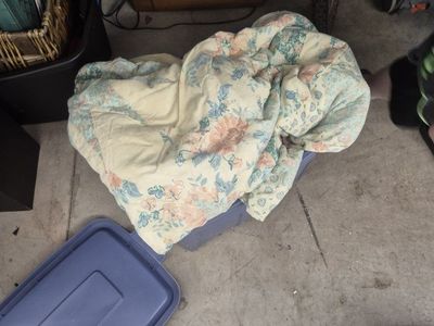 bin of different blankets