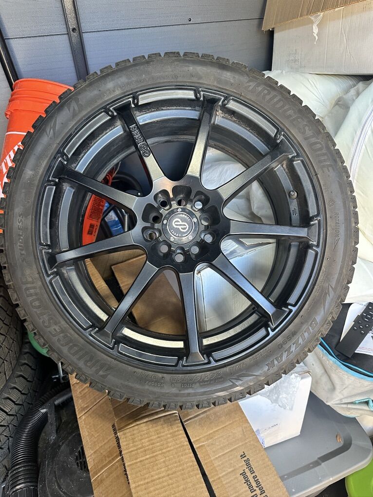 Black Enkei Rims With Blizzak WS90 Snow tires