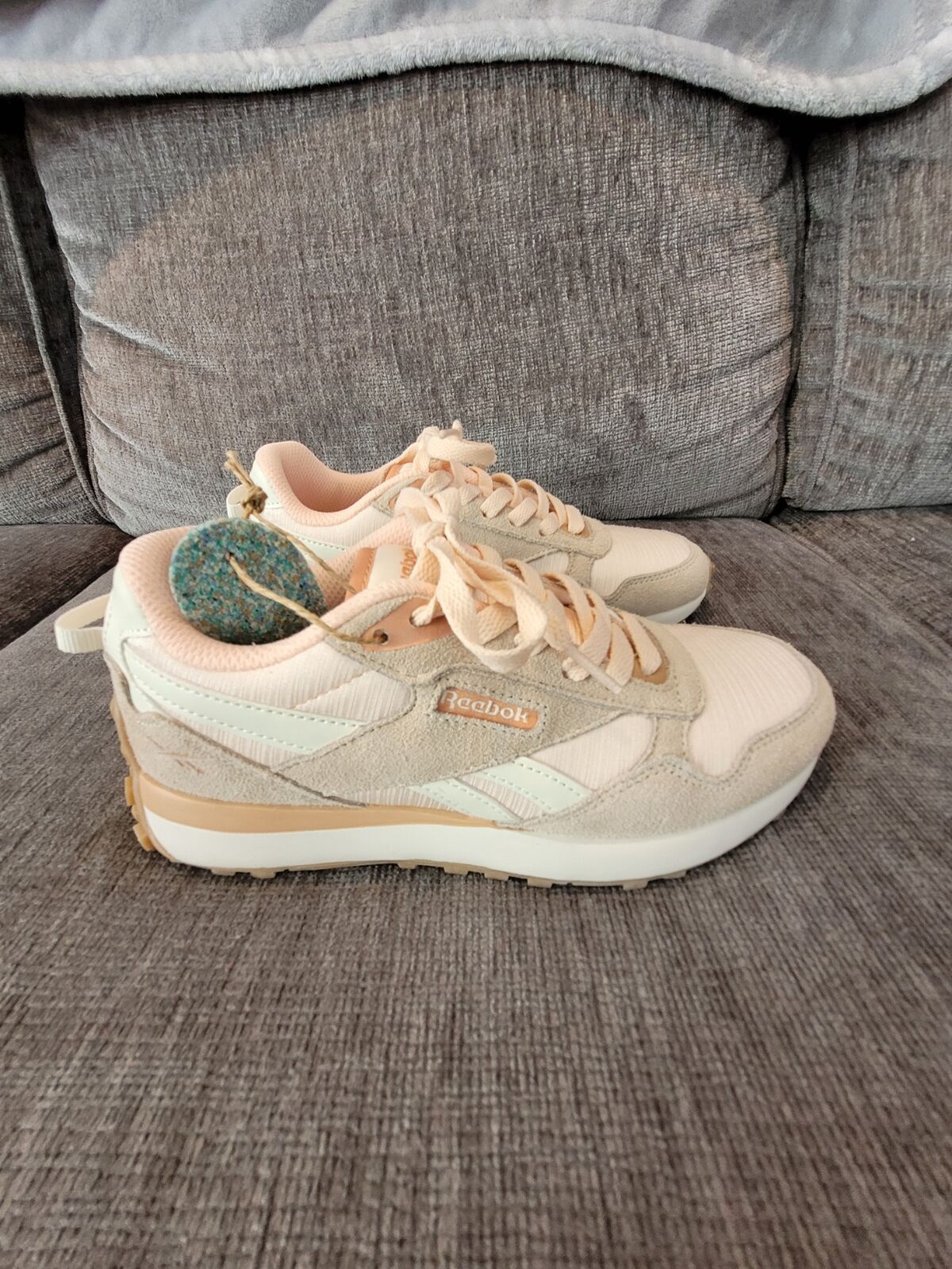 Women’s Pink Salmon and White Reebok’s Size 6