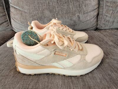 Women’s Pink Salmon and White Reebok’s Size 6