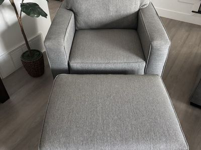 Comfy Large light gray chair with large matching ottoman. Stain protection. Non smoking home.