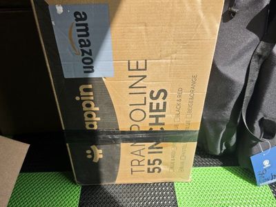 55 in trampoline brand new has enclosure and bar for hanging toys