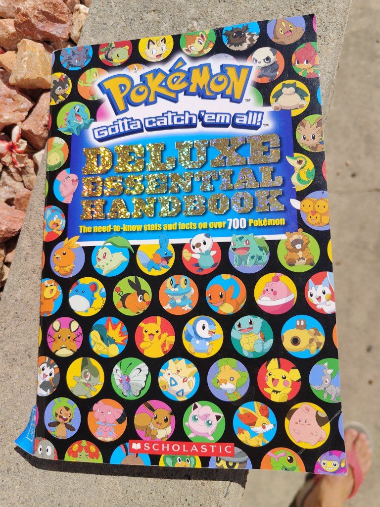 Pokémon Deluxe Essential Handbook Scholastic Paperback Stats & Facts for Over 700 Pokémon