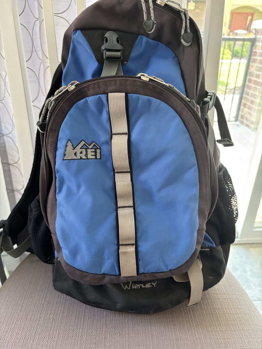 REI Brand backpack with multiple zippered pockets