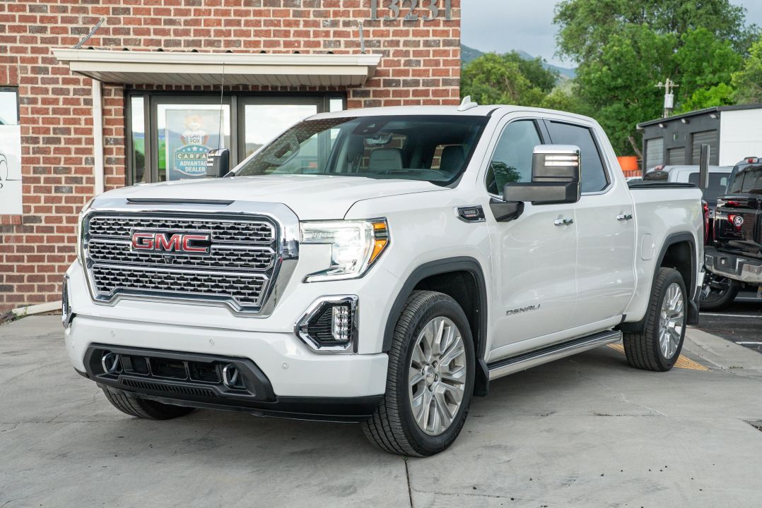 2020 GMC 1500 Denali — rebuilt & branded title, 22% below market