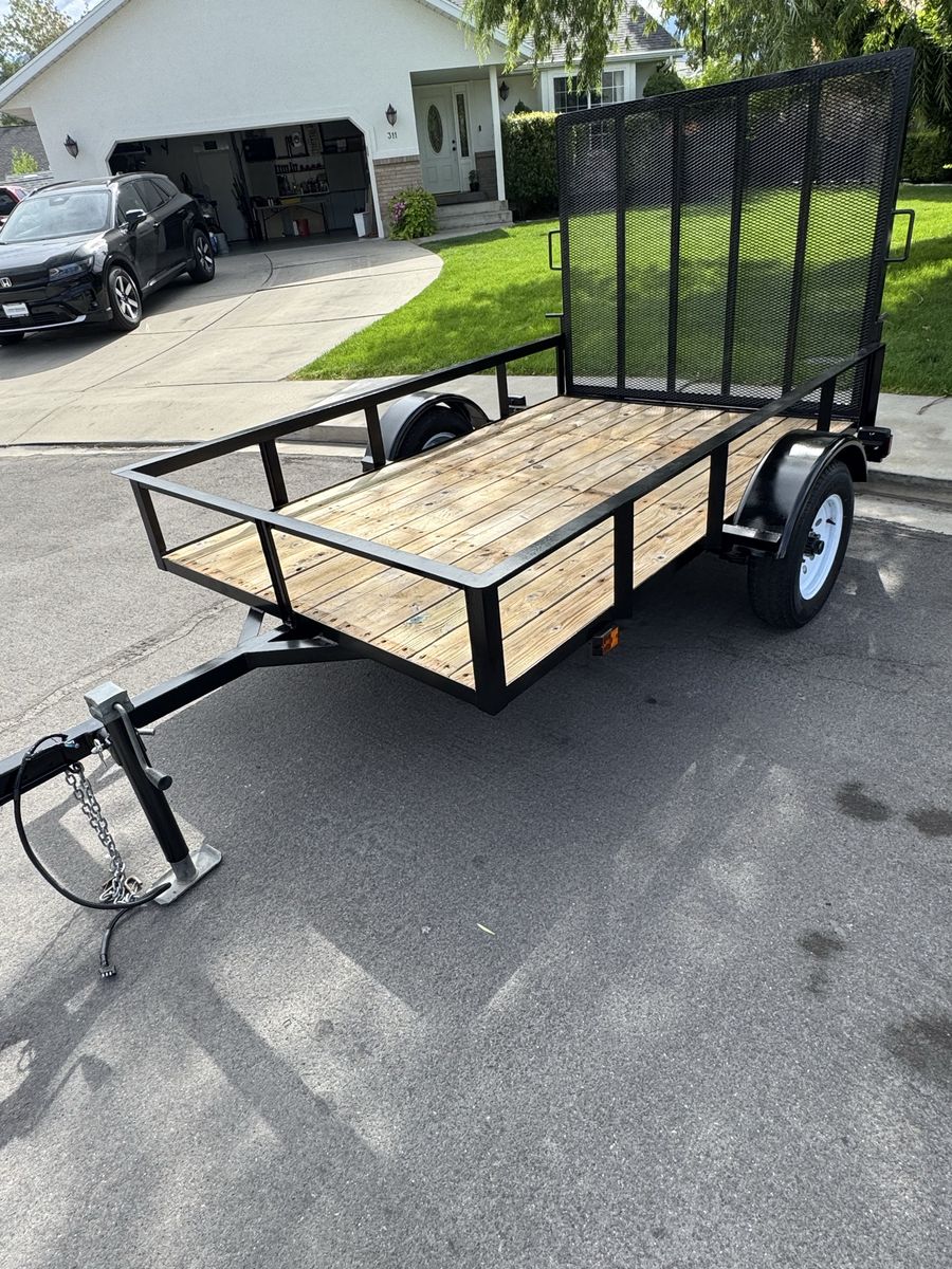 5’ x 8’ Utility Trailer with Wood Deck and Ramp Gate - Used Excellent Condition.