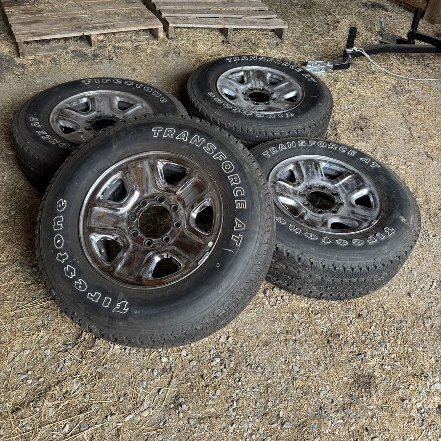 4 four Firestone Transforce AT 275/70r18 tires and chrome wheels like new takeoffs from Ram 2500 3500