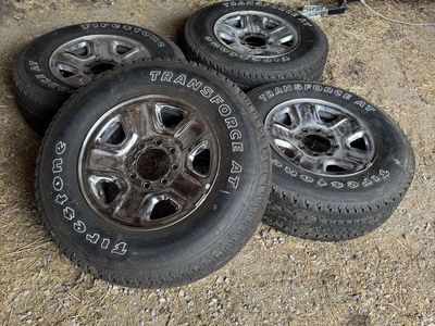 4 four Firestone Transforce AT 275/70r18 tires and chrome wheels like new takeoffs from Ram 2500 3500