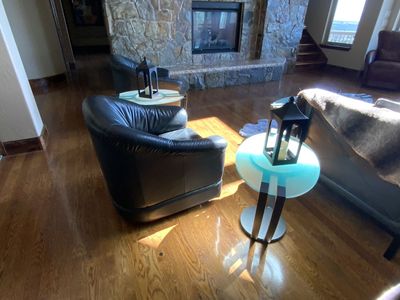 Two black leather barrel chairs