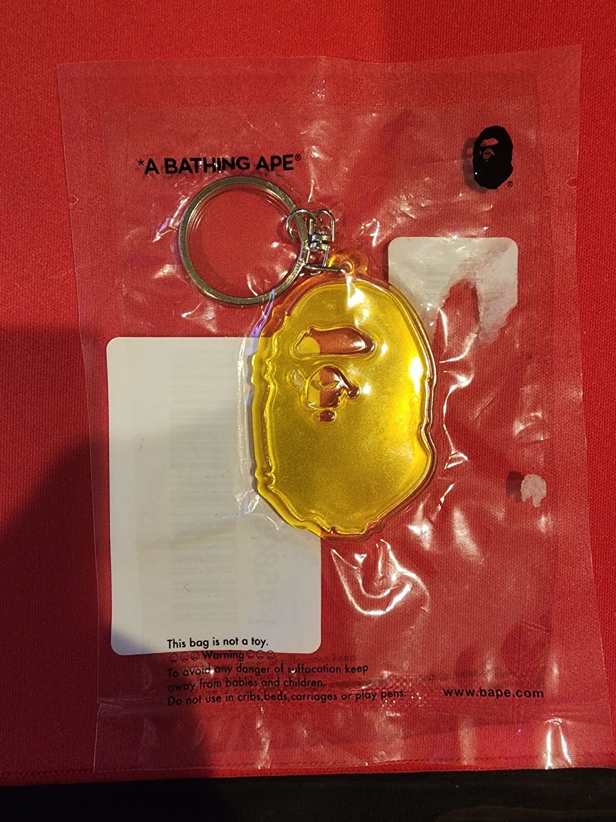 BAPE Ape Head reflective keychain. New, never opened.