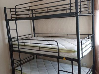 Triple Bunk Bed - Sturdy Metal Frame, Space-Saving Design.
