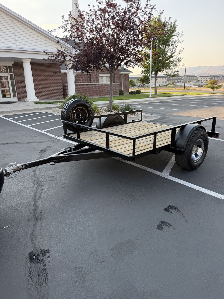 Heavy Duty Single Axle Utility Trailer with Wooden Deck and Mounted Spare Tire